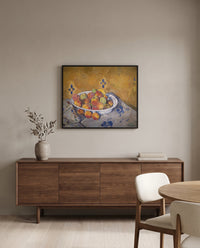 The Plate of Apples by Paul Cézanne in a black frame above a walnut sideboard in a dining room