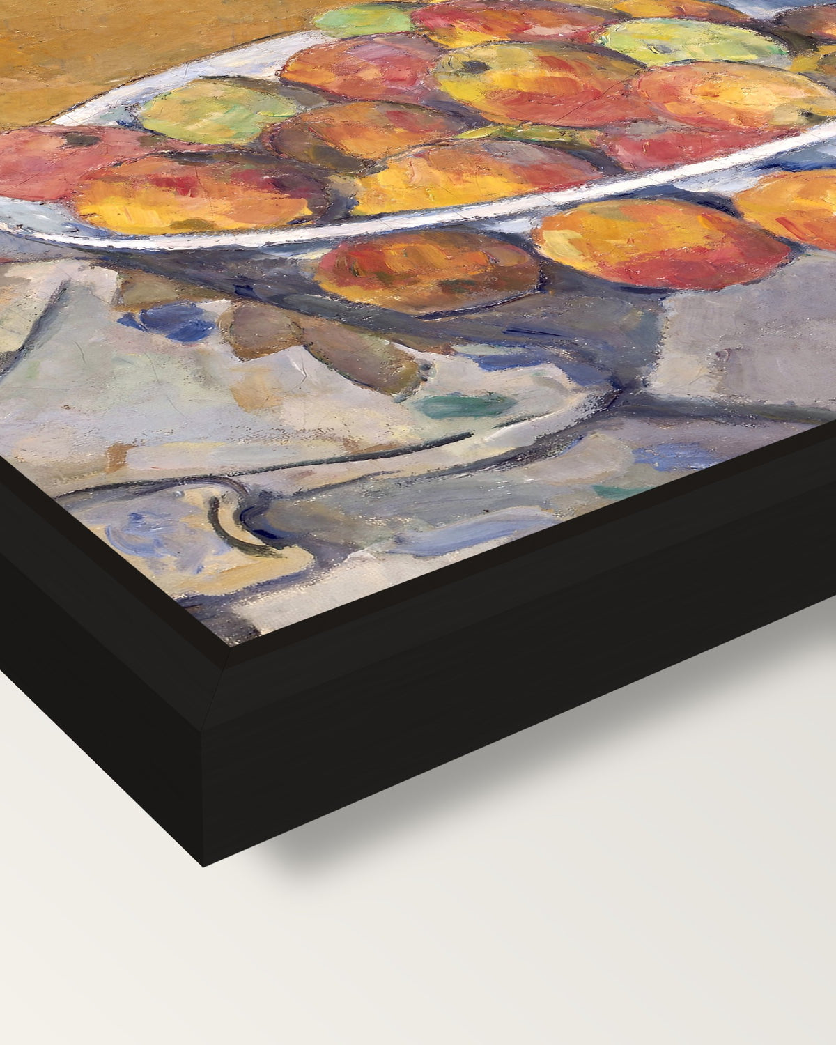 The Plate of Apples by Paul Cézanne framed canvas, corner close-up: a black floating frame with a shadow gap round the canvas