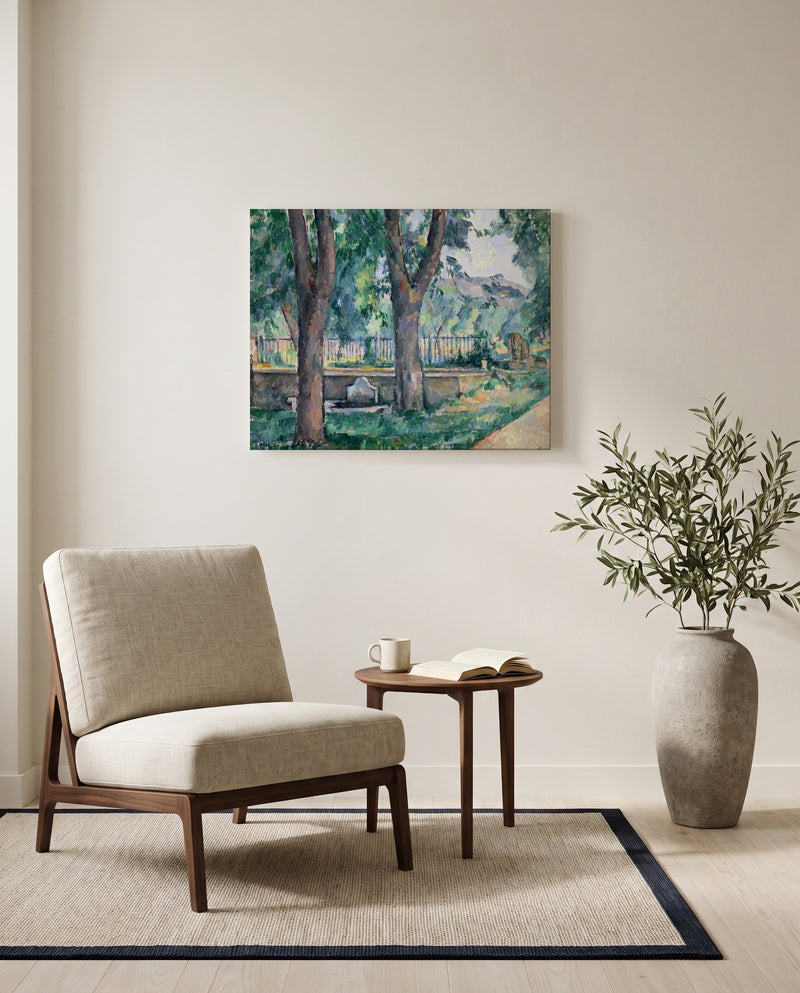 Pool at Jas de Bouffan by Paul Cézanne as a stretched canvas above a linen lounge chair in a reading corner