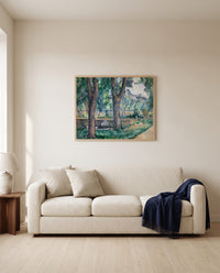 Pool at Jas de Bouffan by Paul Cézanne framed in natural oak above a cream sofa in a warm living room