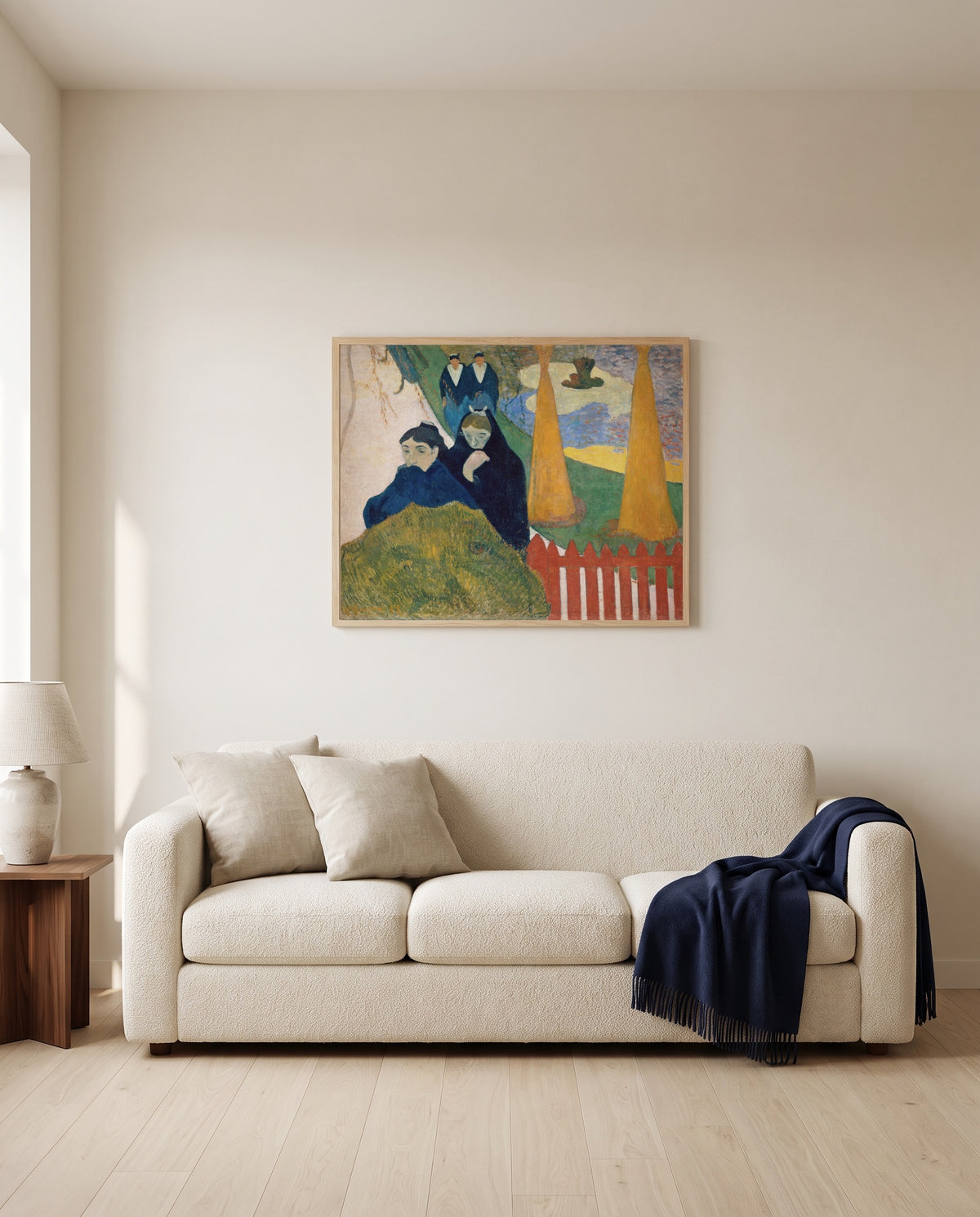 Arlésiennes (Mistral) by Paul Gauguin framed in natural oak above a cream sofa in a warm living room