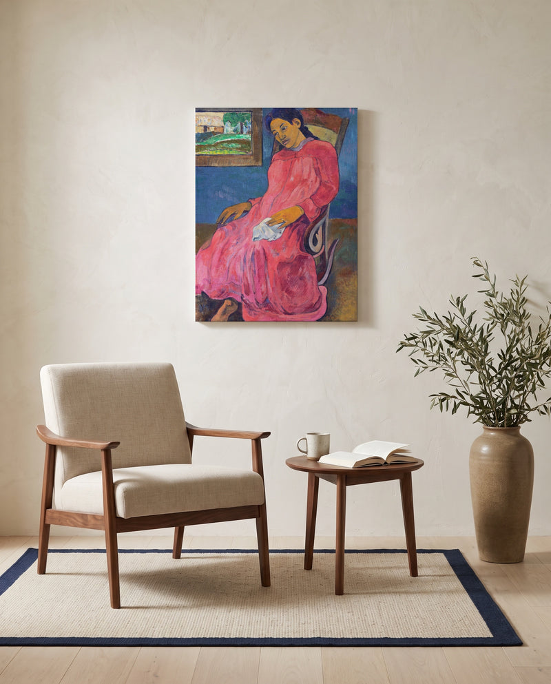Faaturuma by Paul Gauguin as a stretched canvas above a linen lounge chair in a reading corner