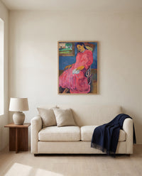 Faaturuma by Paul Gauguin framed in natural oak above a cream sofa in a warm living room