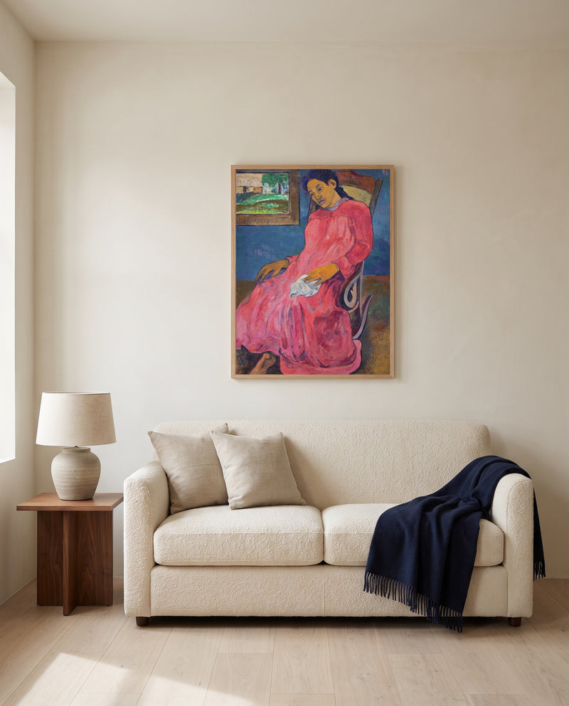 Faaturuma by Paul Gauguin framed in natural oak above a cream sofa in a warm living room