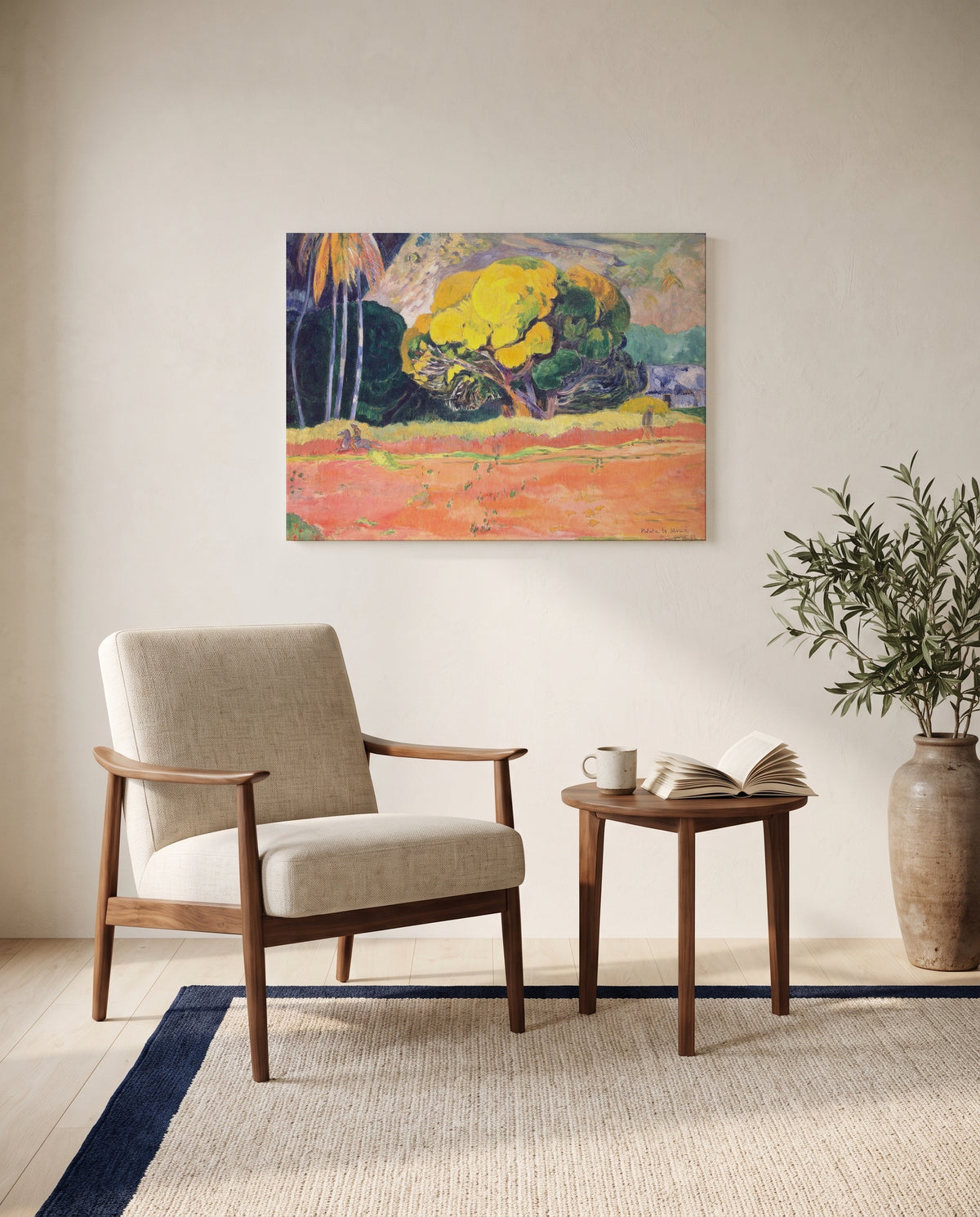 Fatata te Moua by Paul Gauguin as a stretched canvas above a linen lounge chair in a reading corner
