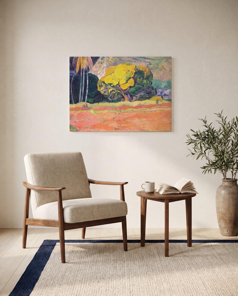 Fatata te Moua by Paul Gauguin as a stretched canvas above a linen lounge chair in a reading corner