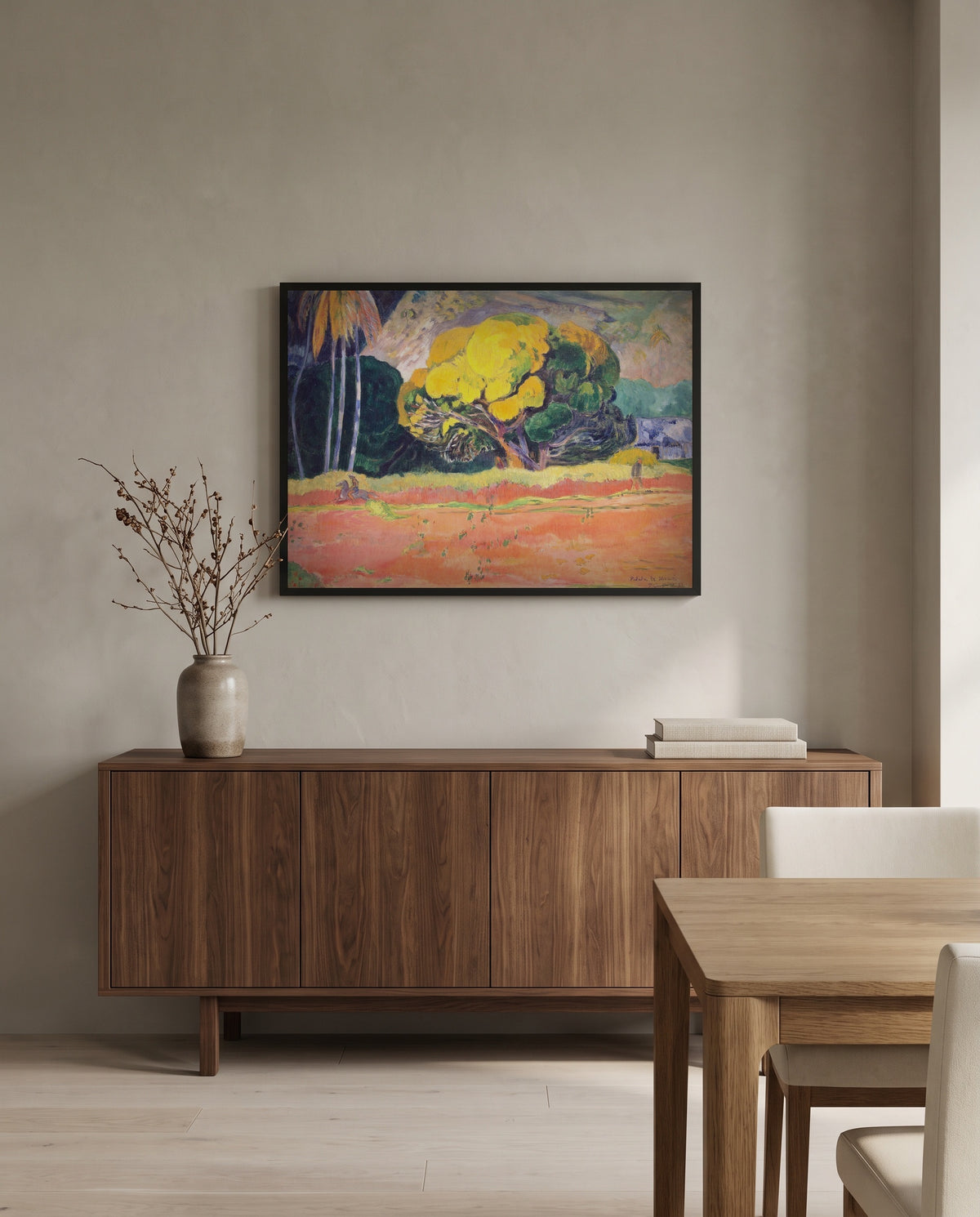 Fatata te Moua by Paul Gauguin in a black frame above a walnut sideboard in a dining room