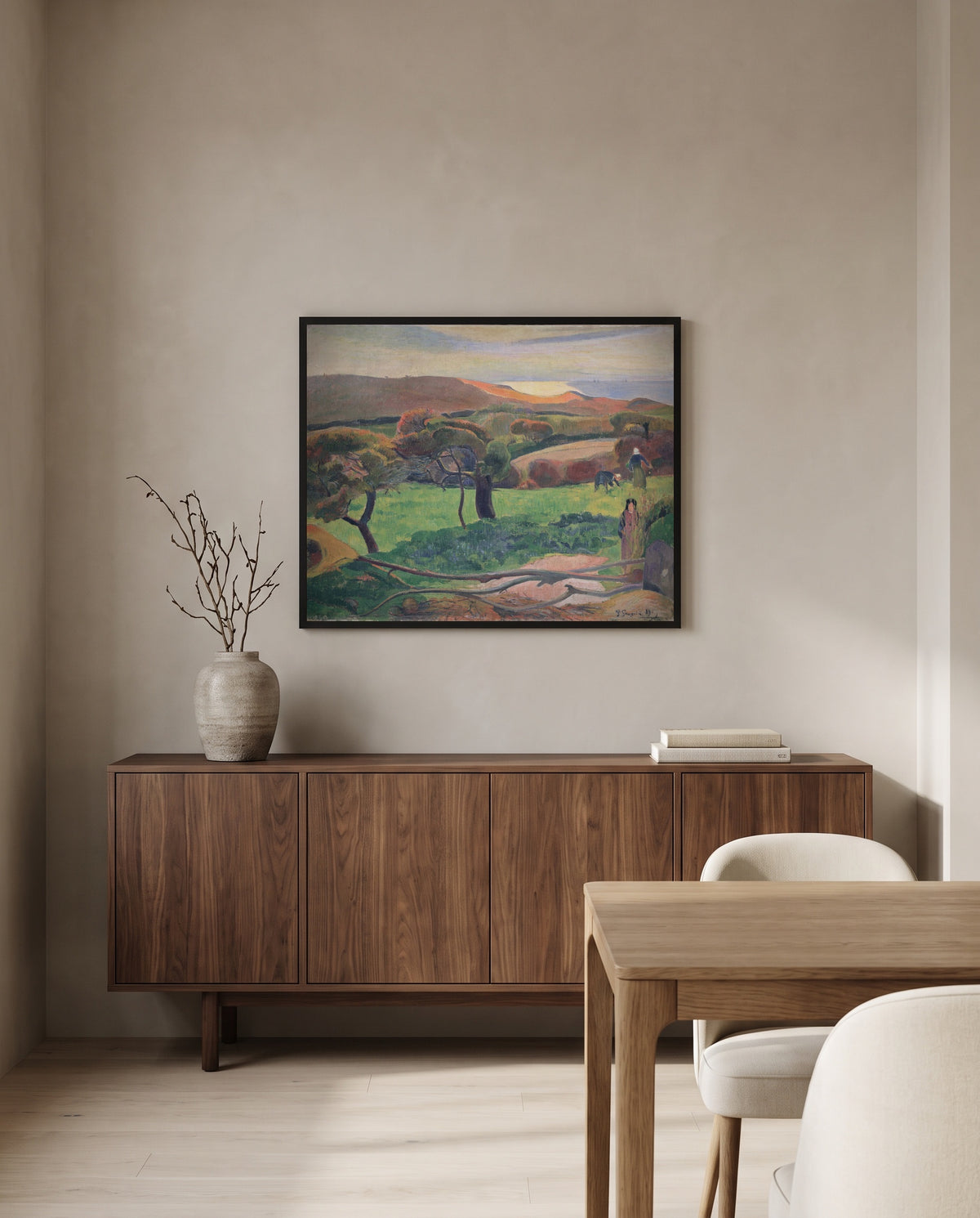 Fields by the Sea by Paul Gauguin in a black frame above a walnut sideboard in a dining room