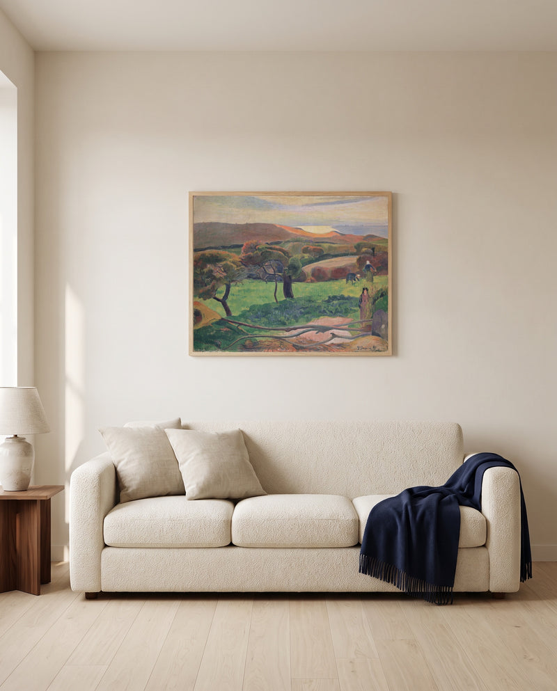 Fields by the Sea by Paul Gauguin framed in natural oak above a cream sofa in a warm living room