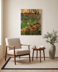 Landscape from Pont-Aven by Paul Gauguin as a stretched canvas above a linen lounge chair in a reading corner