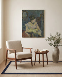 Mette Gauguin by Paul Gauguin as a stretched canvas above a linen lounge chair in a reading corner