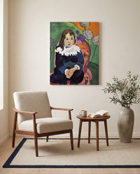 Mr. Loulou by Paul Gauguin as a stretched canvas above a linen lounge chair in a reading corner