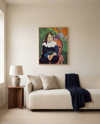 Mr. Loulou by Paul Gauguin framed in natural oak above a cream sofa in a warm living room