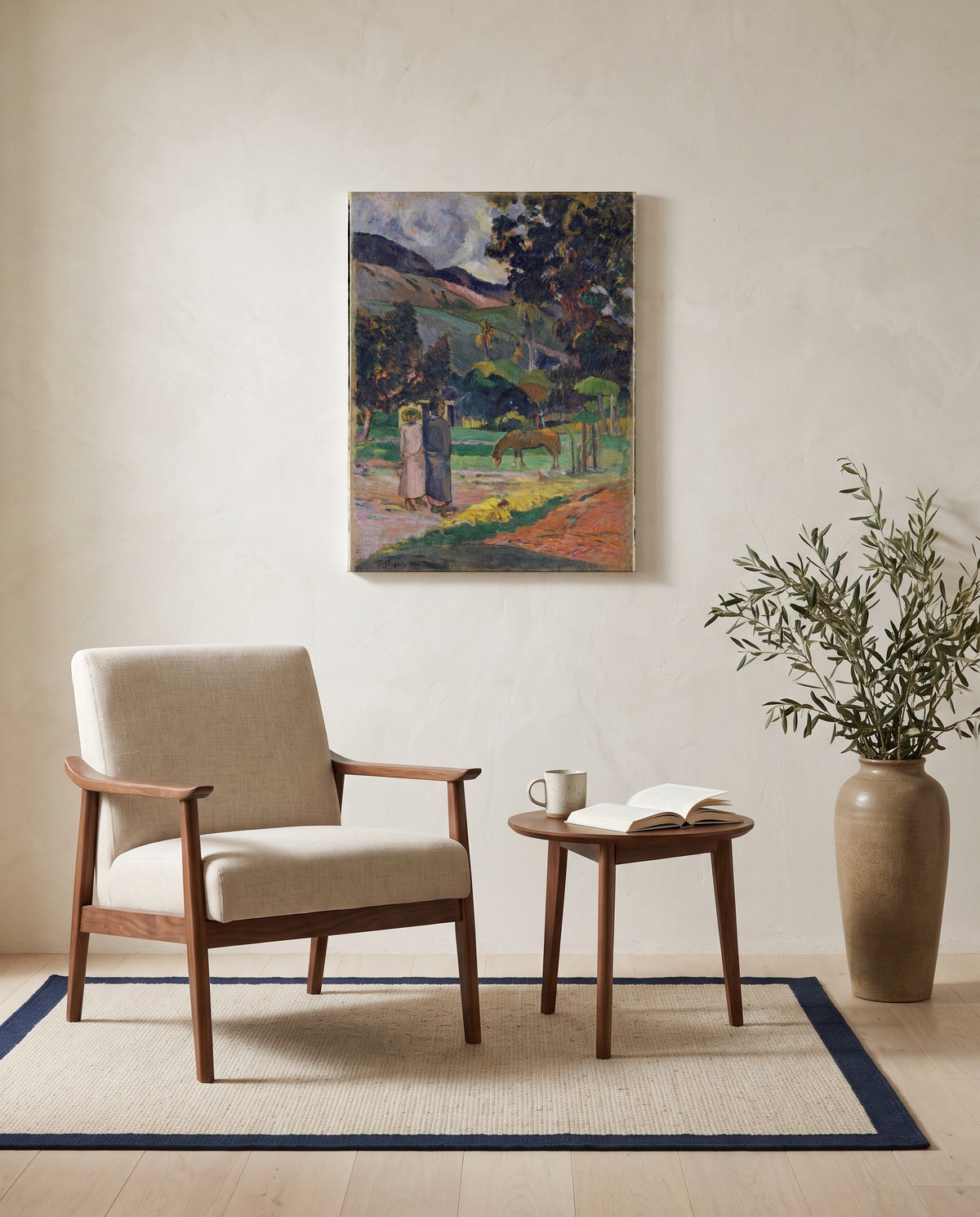 Tahitian Landscape, 1892 by Paul Gauguin as a stretched canvas above a linen lounge chair in a reading corner