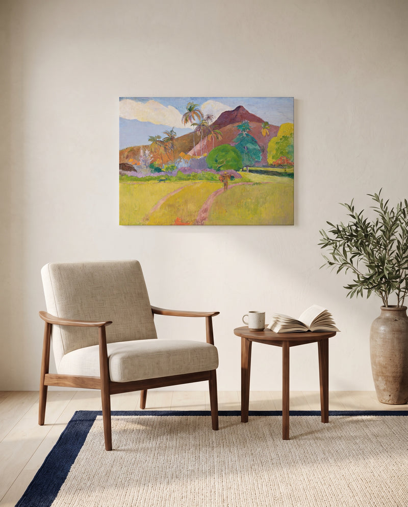 Tahitian Landscape by Paul Gauguin as a stretched canvas above a linen lounge chair in a reading corner
