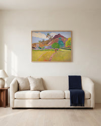 Tahitian Landscape by Paul Gauguin framed in natural oak above a cream sofa in a warm living room