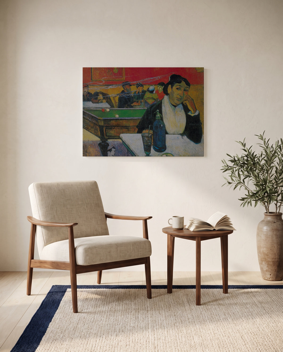The Night Café at Arles by Paul Gauguin as a stretched canvas above a linen lounge chair in a reading corner