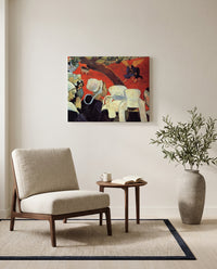 Vision after the Sermon by Paul Gauguin as a stretched canvas above a linen lounge chair in a reading corner