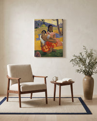 When Will You Marry? by Paul Gauguin as a stretched canvas above a linen lounge chair in a reading corner