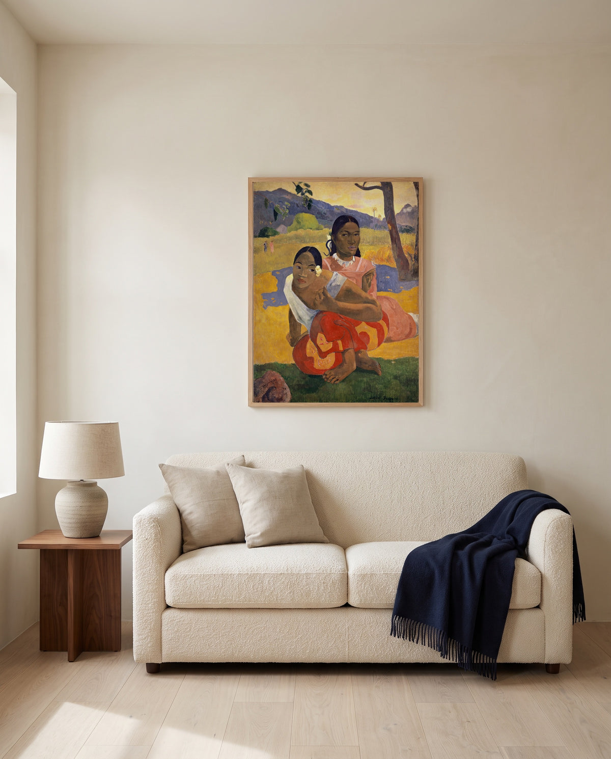 When Will You Marry? by Paul Gauguin framed in natural oak above a cream sofa in a warm living room