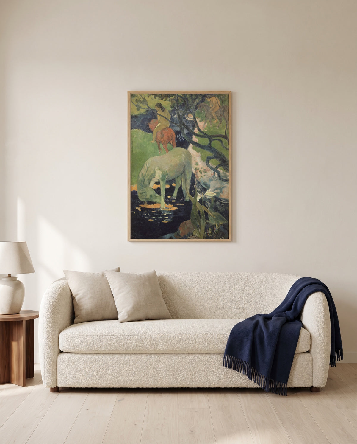The White Horse by Paul Gauguin framed in natural oak above a cream sofa in a warm living room
