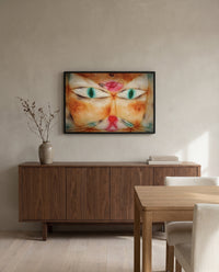 Cat and Bird by Paul Klee in a black frame above a walnut sideboard in a dining room