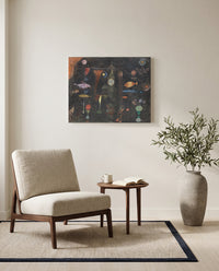 Fish Magic by Paul Klee as a stretched canvas above a linen lounge chair in a reading corner
