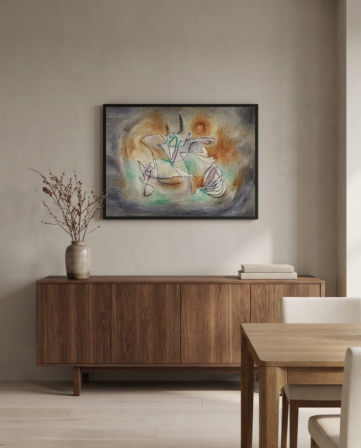 Howling Dog by Paul Klee in a black frame above a walnut sideboard in a dining room