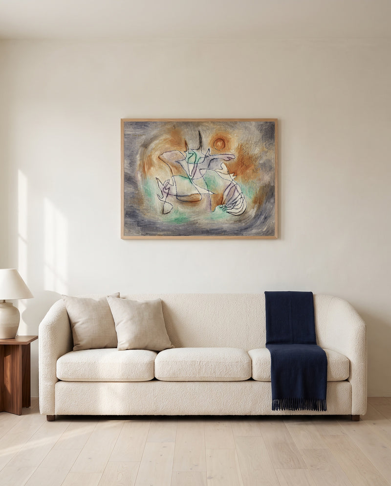 Howling Dog by Paul Klee framed in natural oak above a cream sofa in a warm living room