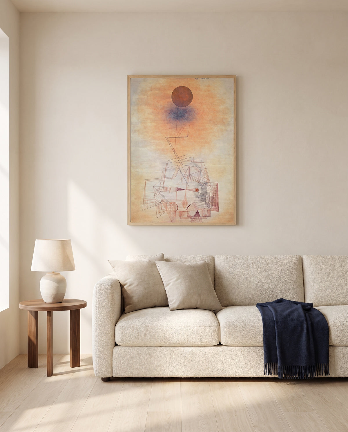 Limits of Reason by Paul Klee framed in natural oak above a cream sofa in a warm living room