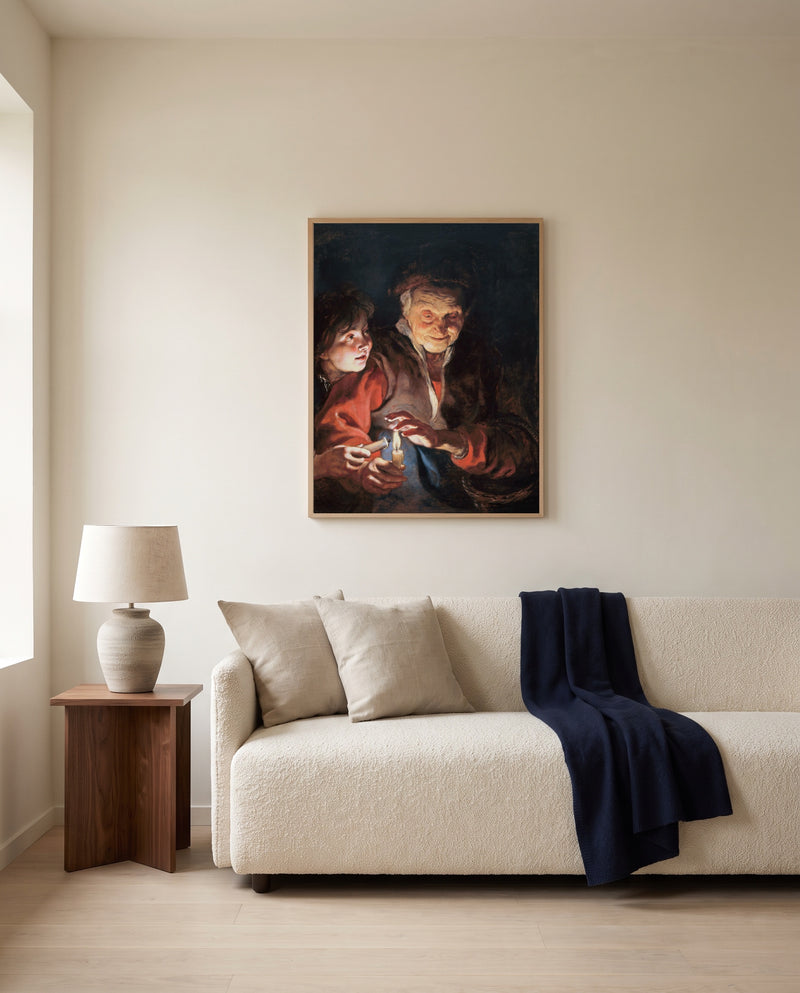 Old Woman and Boy, Candles by Peter Paul Rubens framed in natural oak above a cream sofa in a warm living room