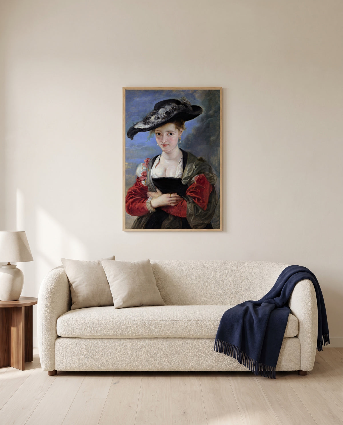 Le Chapeau de Paille by Peter Paul Rubens framed in natural oak above a cream sofa in a warm living room