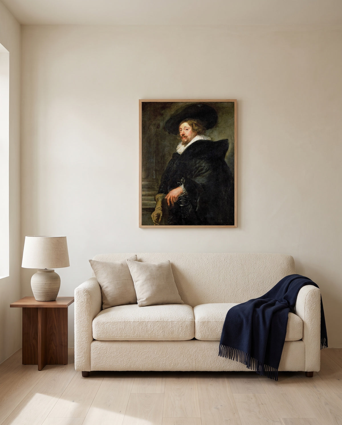 Self-Portrait by Peter Paul Rubens framed in natural oak above a cream sofa in a warm living room