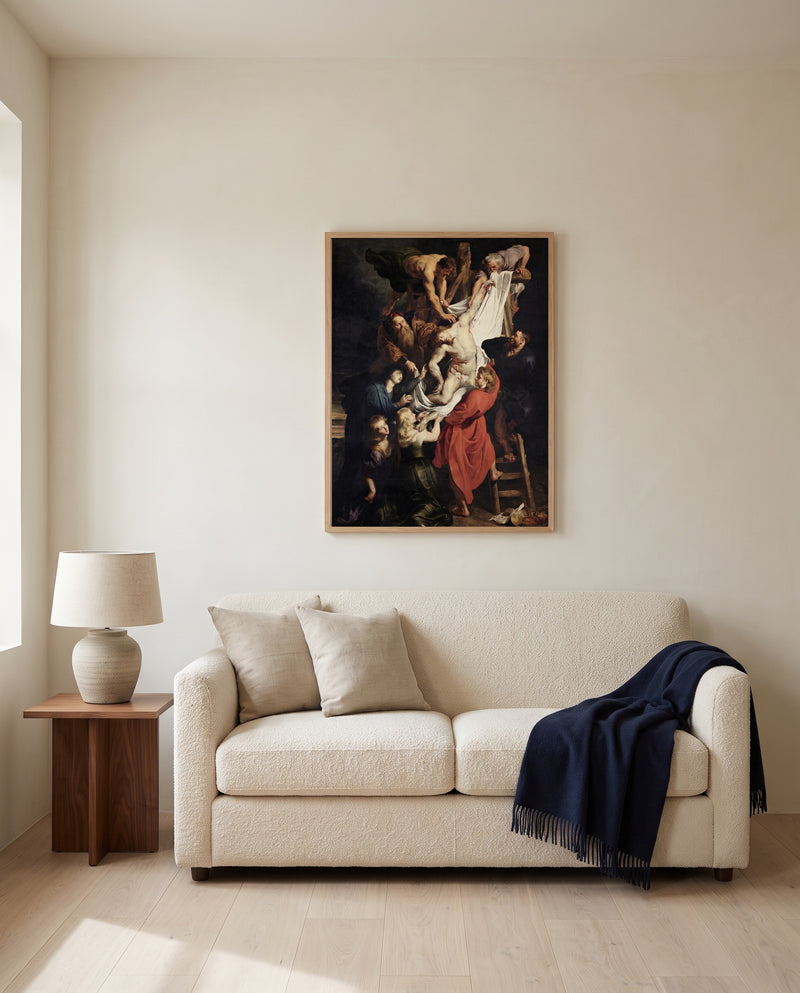 The Descent from the Cross by Peter Paul Rubens framed in natural oak above a cream sofa in a warm living room