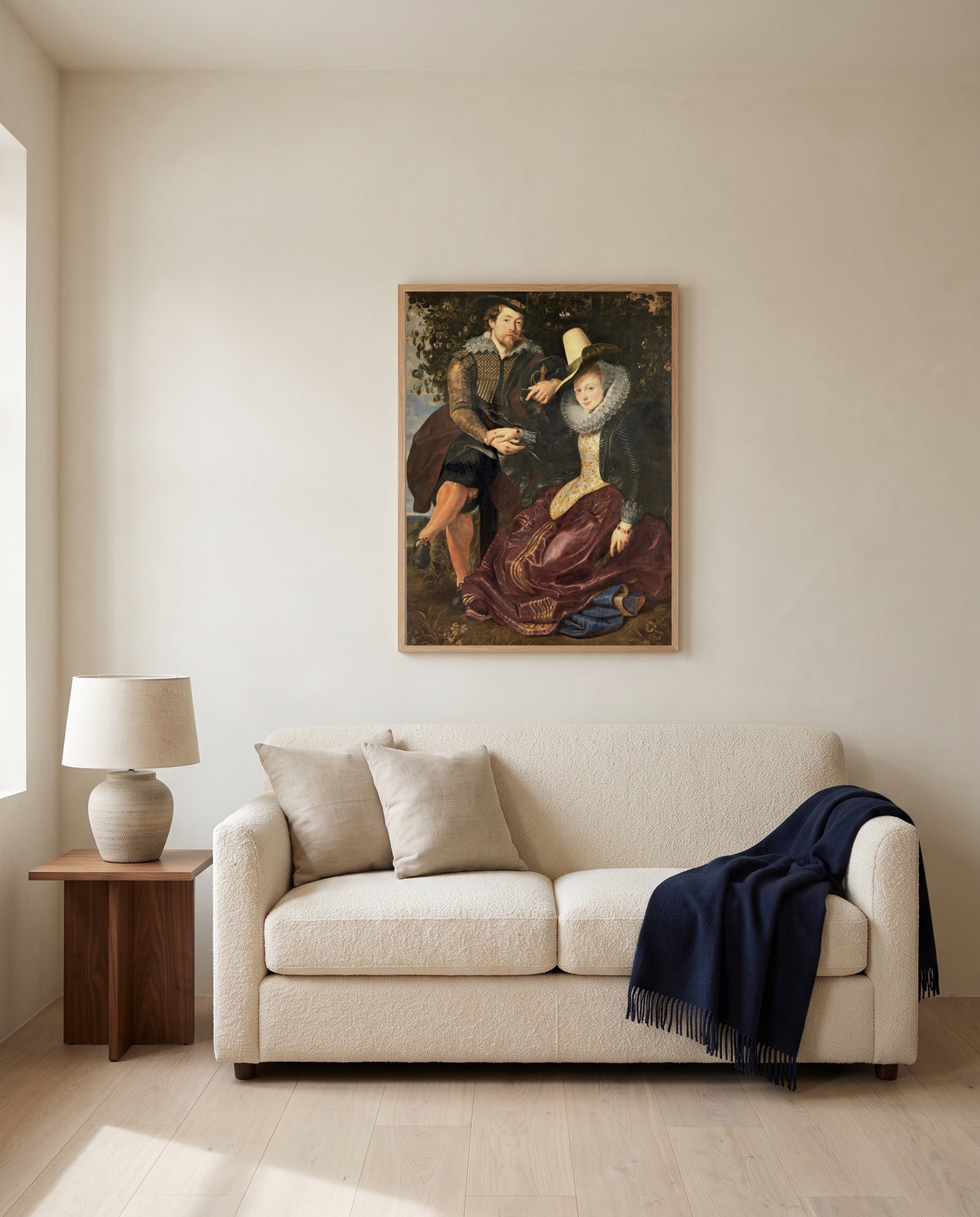 The Honeysuckle Bower by Peter Paul Rubens framed in natural oak above a cream sofa in a warm living room