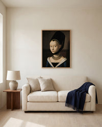 Portrait of a Young Girl by Petrus Christus framed in natural oak above a cream sofa in a warm living room