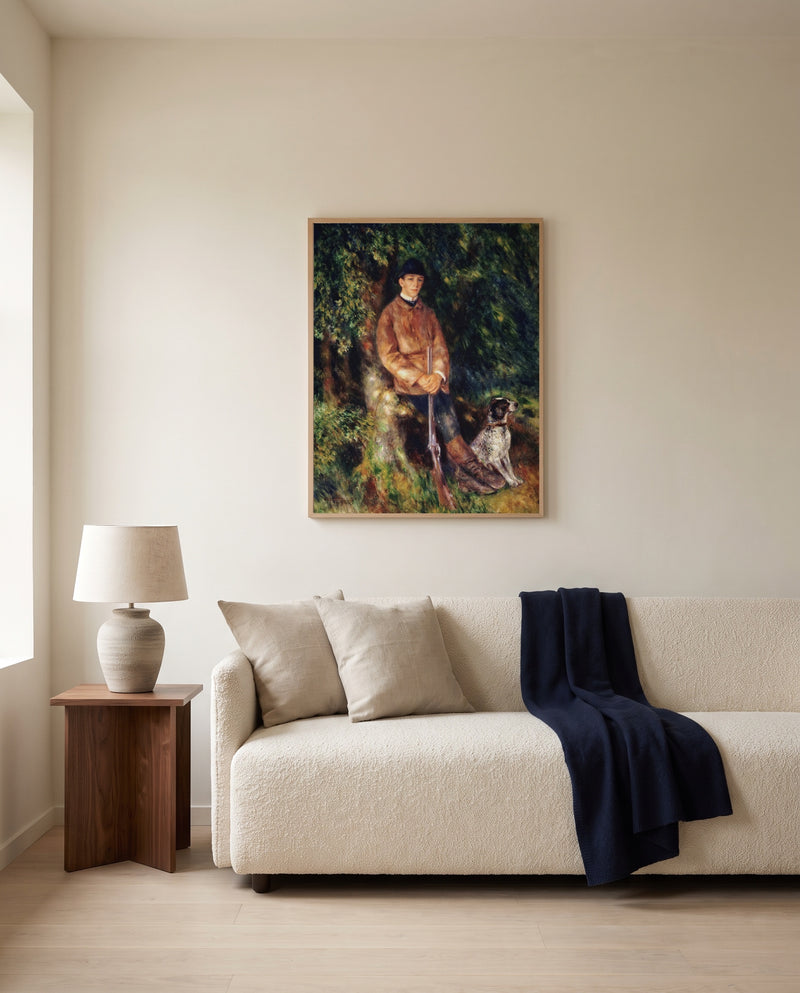Alfred Bérard and His Dog by Pierre-Auguste Renoir framed in natural oak above a cream sofa in a warm living room