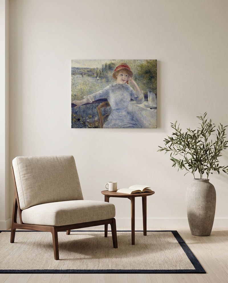 Alphonsine Fournaise by Pierre-Auguste Renoir as a stretched canvas above a linen lounge chair in a reading corner