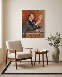 Ambroise Vollard by Pierre-Auguste Renoir as a stretched canvas above a linen lounge chair in a reading corner