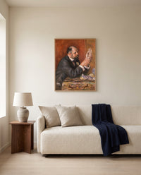 Ambroise Vollard by Pierre-Auguste Renoir framed in natural oak above a cream sofa in a warm living room