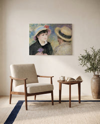 Boating Couple by Pierre-Auguste Renoir as a stretched canvas above a linen lounge chair in a reading corner