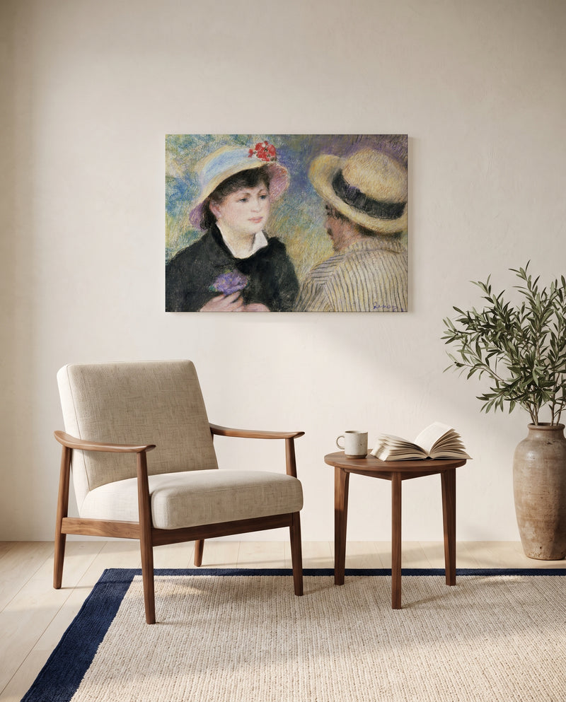 Boating Couple by Pierre-Auguste Renoir as a stretched canvas above a linen lounge chair in a reading corner