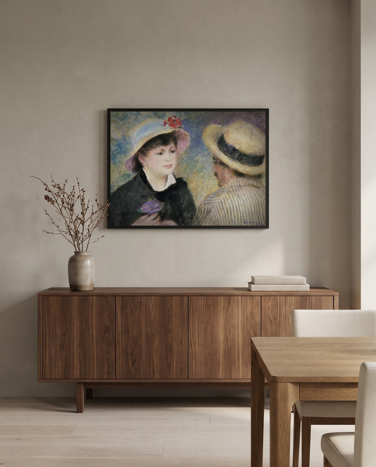 Boating Couple by Pierre-Auguste Renoir in a black frame above a walnut sideboard in a dining room