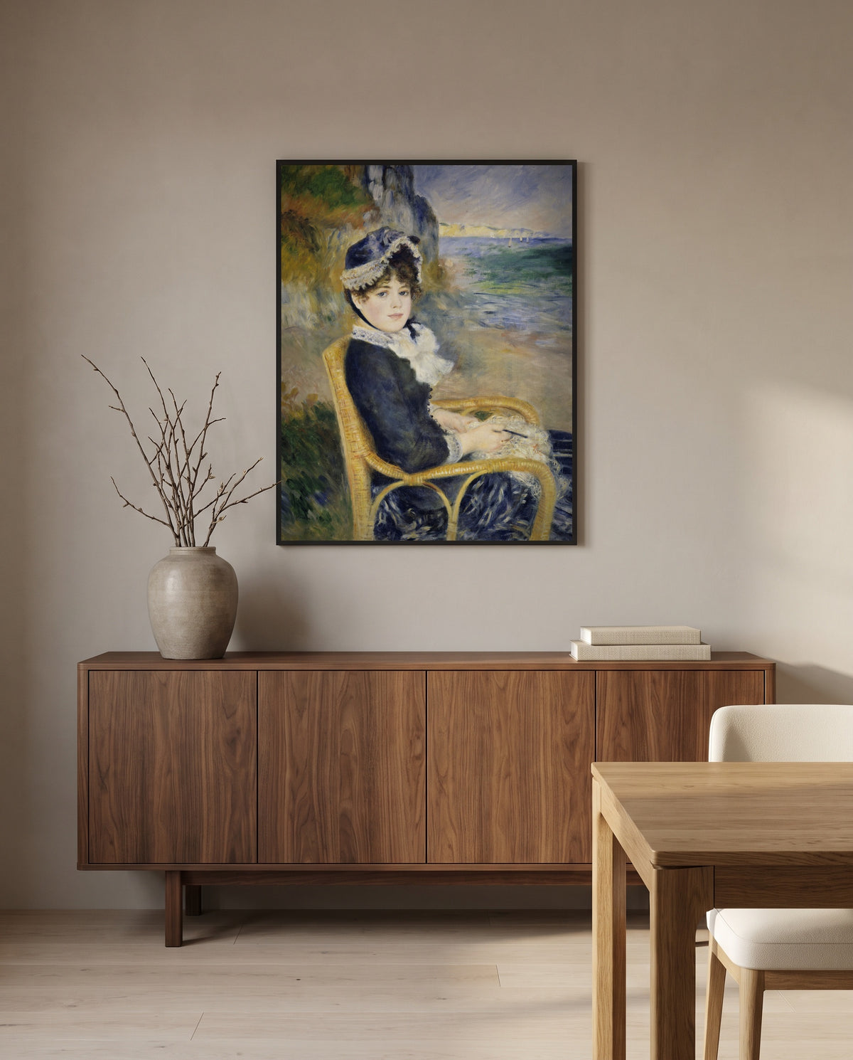 By the Seashore by Pierre-Auguste Renoir in a black frame above a walnut sideboard in a dining room