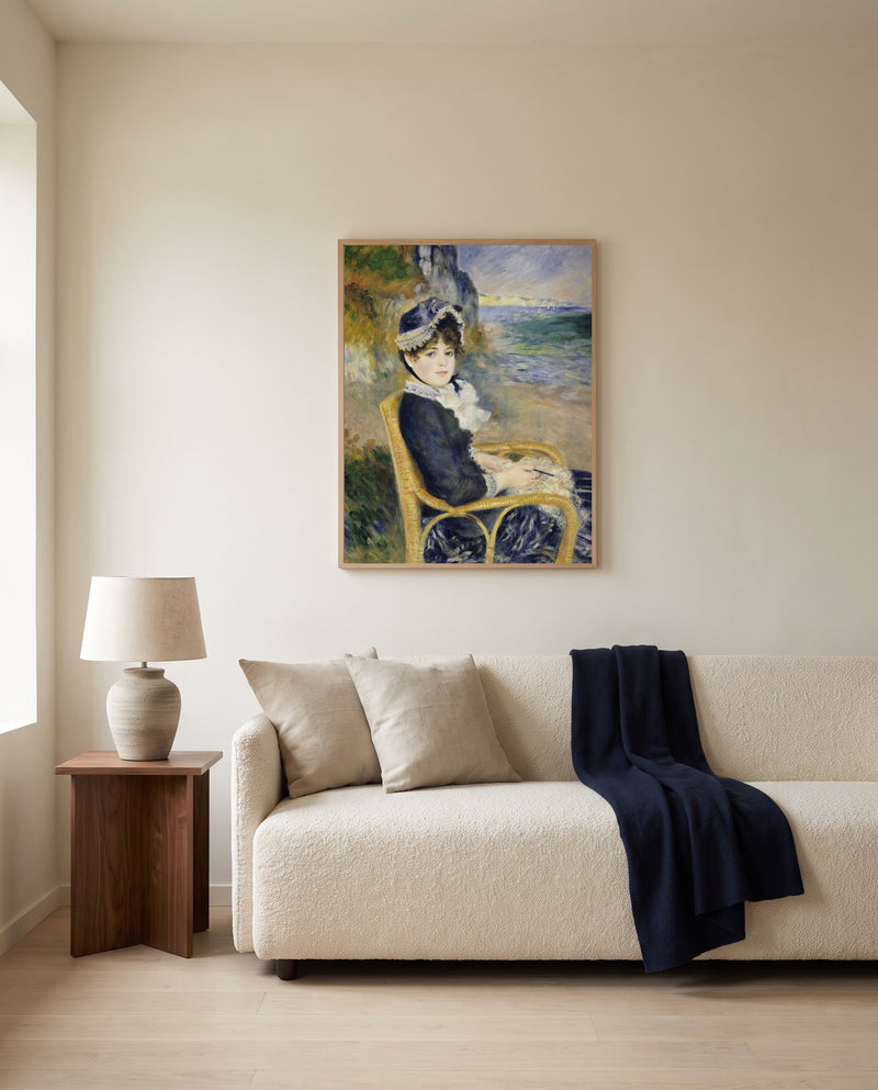 By the Seashore by Pierre-Auguste Renoir framed in natural oak above a cream sofa in a warm living room