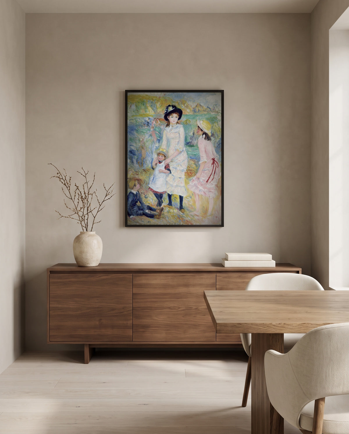 Children on the Seashore by Pierre-Auguste Renoir in a black frame above a walnut sideboard in a dining room