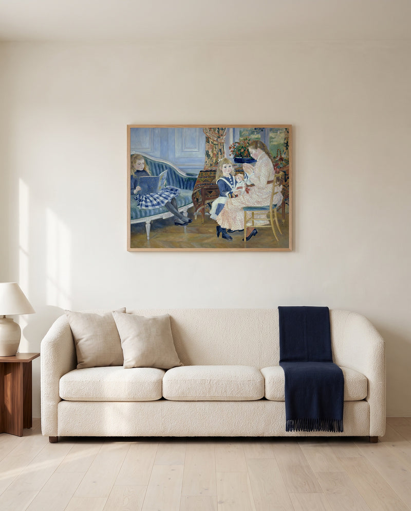 Afternoon at Wargemont by Pierre-Auguste Renoir framed in natural oak above a cream sofa in a warm living room