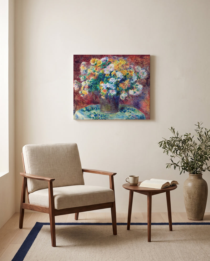 Chrysanthemums by Pierre-Auguste Renoir as a stretched canvas above a linen lounge chair in a reading corner