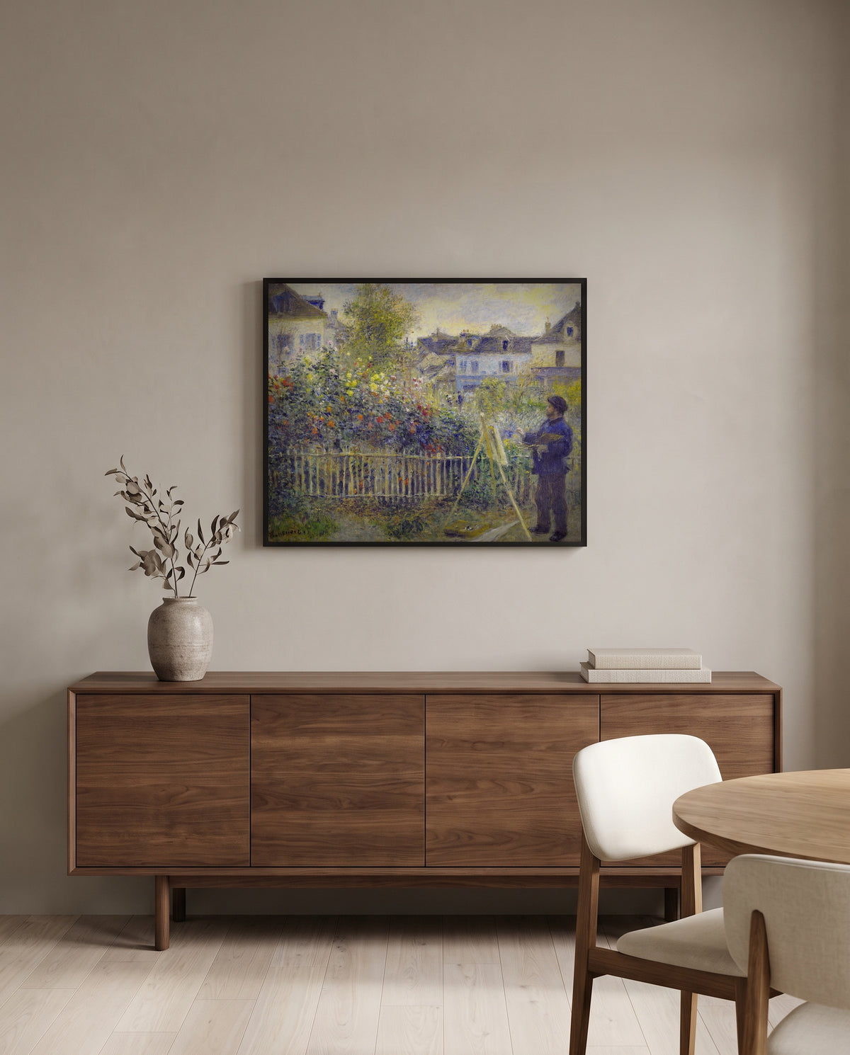 Monet in His Garden by Pierre-Auguste Renoir in a black frame above a walnut sideboard in a dining room