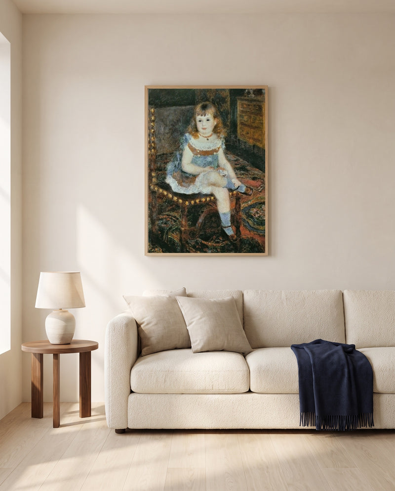 Georgette Charpentier by Pierre-Auguste Renoir framed in natural oak above a cream sofa in a warm living room